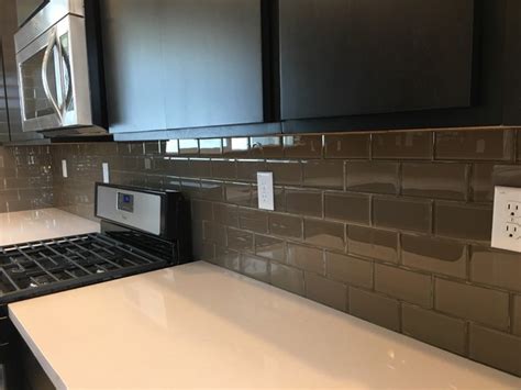 kitchen backsplash brown glass subway tile counter to ceiling