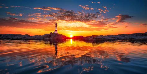 sunsets lighthouse sunset reflection beautiful sky fiery