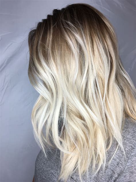blonde balayage and foilayage combo with a root smudge icy blonde