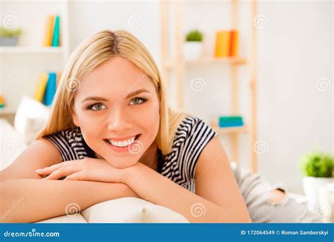 portrait  attractive young woman  beaming smile resting  home