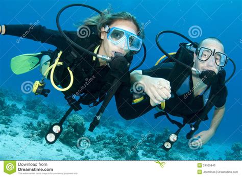 man and woman scuba dive togeather stock image image 24555943