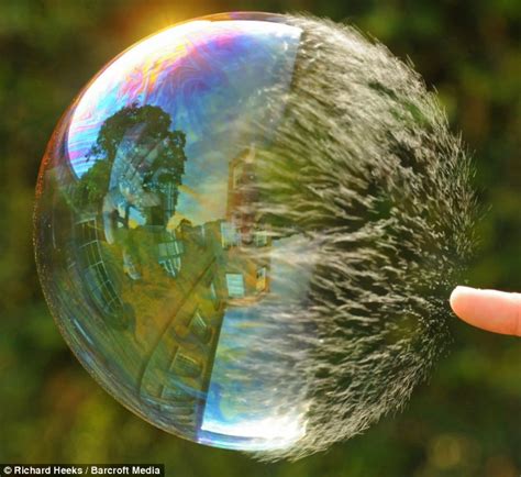 Super Slow Motion Pictures Show Soap Bubble Bursting In Stunning Detail