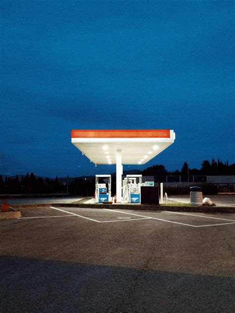 white  red gasoline station photo  gas station image  unsplash