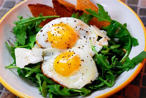 Breakfast Salad Eggs Over Arugula With Shaved Parmesan