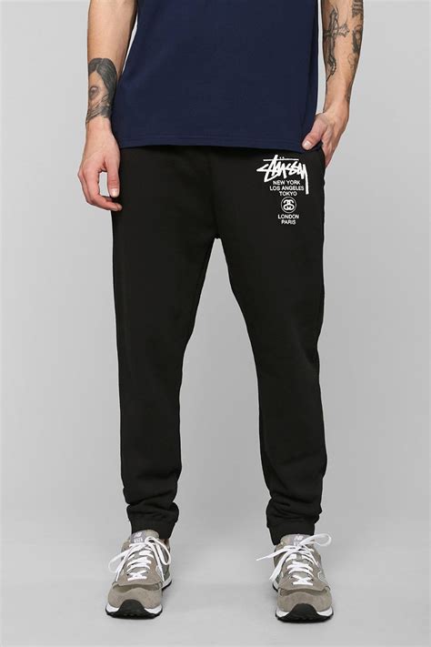 stussy world tour sweatpant in black for men lyst