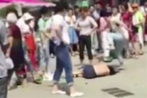 jilted wife strips and beats husband s mistress in full view of public in shocking video