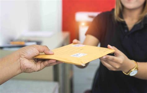 male hand send mail envelope   female  post office  sending berardi immigration law