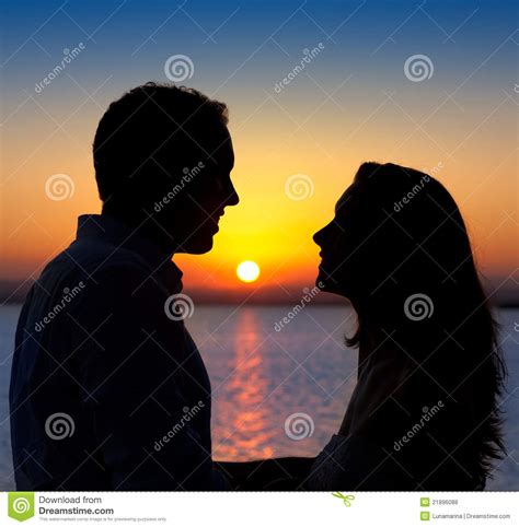 Couple In Love Silhouette At Lake Sunset Royalty Free