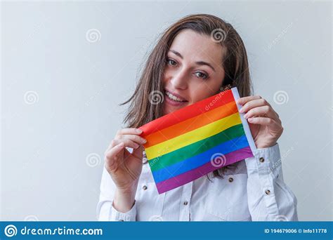 beautiful caucasian lesbian girl with lgbt rainbow flag