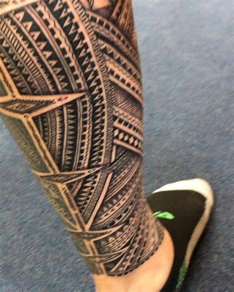 mans leg   intricate tattoo
