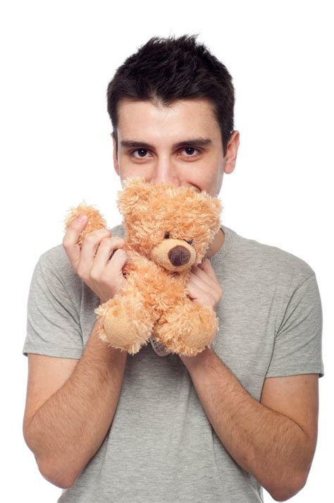 man cuddling teddy bear royalty  stock photo image