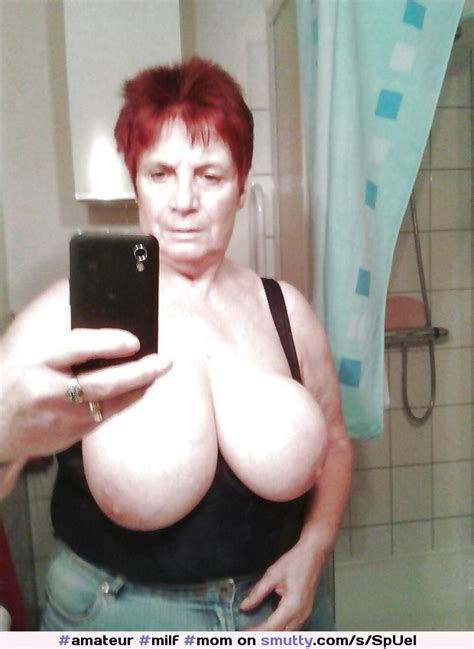 redhead grandmother boasts big tits in mirror selfie amateur milf