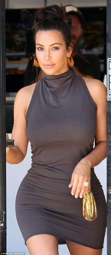 Kim Kardashian Shows Off Her Hourglass Figure In Strapless Silk Dress