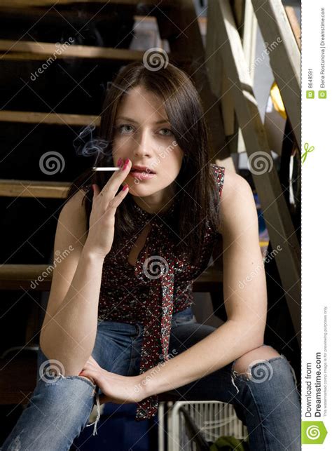 Smoking Girl In Jeans Having Hole Stock Image Image 8648591