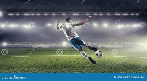soccer player hitting ball stock photo image  light