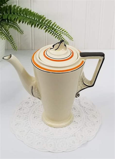 burleigh ware pottery teapot  art deco cream coloured  orange  black design