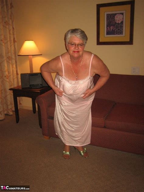 nice elderly blonde with short hair wearing soft pink silk