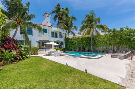 waterfront home   venetian islands sees  price reduction