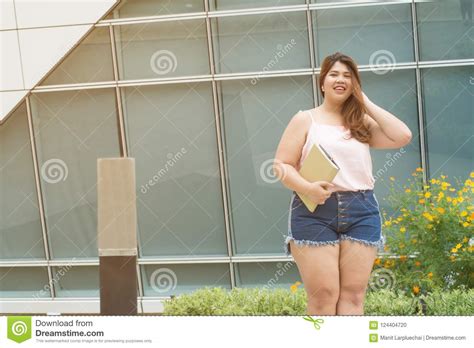 portrait of asian pretty smiley face fat woman pose and