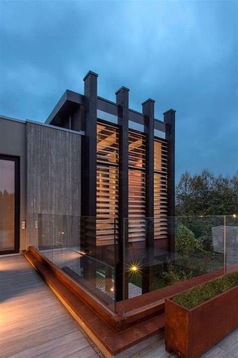 modern concrete block house  wooden patio attached