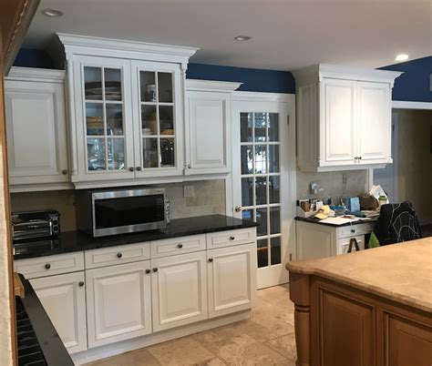 white kitchen cabinets paired  navy walls monks  nj