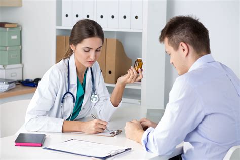 female medicine doctor prescribing pills   male patient healthcare