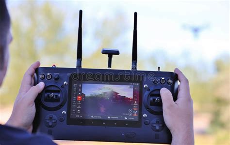 man operating camera drone  radio control system stock image image  blue colors