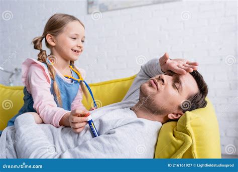 Man Pretending Sick Near Smiling Daughter Stock Image Image Of