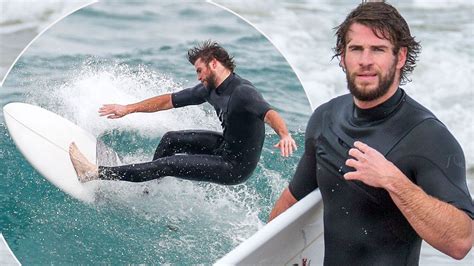 liam hemsworth squeezes into very tight wetsuit for surfing session in