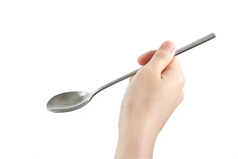 hand holding spoon stock  pictures royalty  images