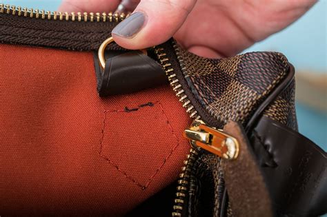 here s how to spot the difference between real and fake designer bags
