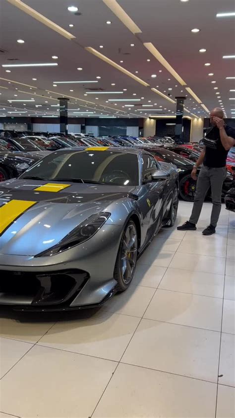 andrew tate  ferrari shopping  news page video