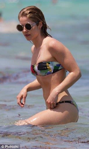 arrow star katie cassidy snaps selfies in a silver bikini while enjoying beach day daily mail