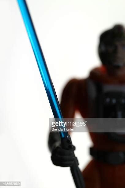 man holding lightsaber   premium high res pictures getty images