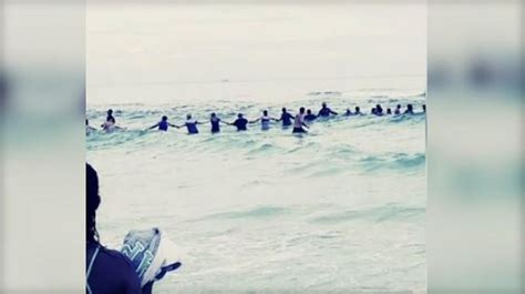 strangers form human chain to rescue swimmers at panama city beach