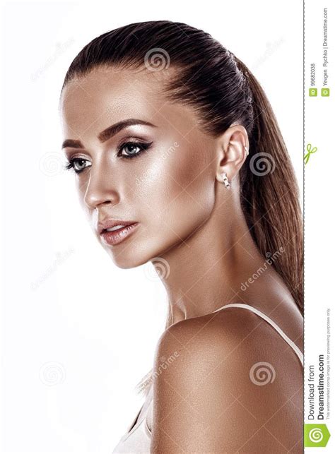 Portrait Of A Beautiful Tanned Brunette Woman With Makeup