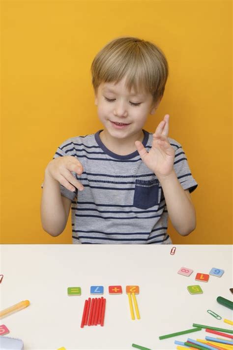 boy preparing  elementary school  simple math exercises