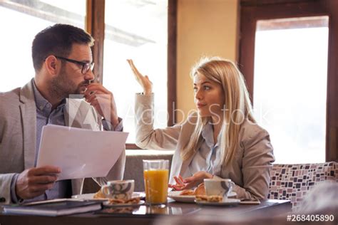 beautiful young blonde boss explains   manager whats wrong   report  sitting