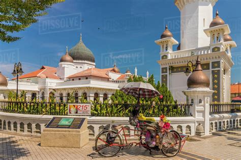 local rickshaw tuk tuk  kapitan keling mosque george town penang island malaysia