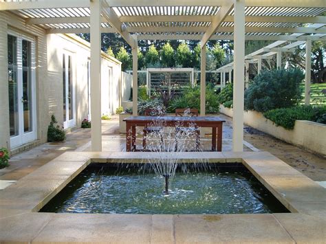 courtyard garden   acreage residence  shoreham  water feature  pergola