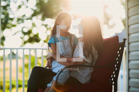 Mother And Daughter Talking On The Porch — Photo — Lightstock