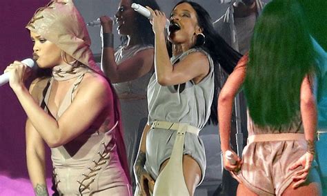 rihanna shows off some new curves as she takes the stage