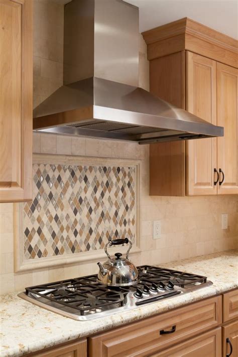 kitchen  diamond shaped tile backsplash  stainless steel range hood hgtv