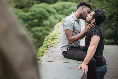 men kissing   stock photo
