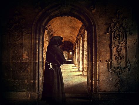 monk standing   doorway   monastery image  stock photo