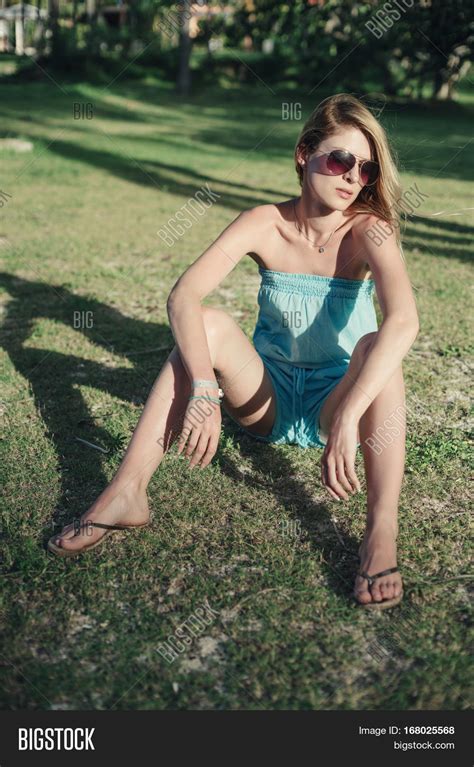 Girl Sitting On Lawn Posing Image And Photo Bigstock