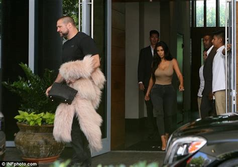 kim kardashian shows off her curves as she goes braless in a skintone