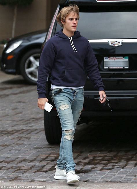 justin bieber keeps things comfortable in ripped denim daily mail online