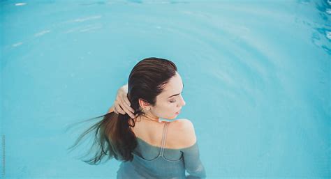 Woman Enjoying Swimming Pool By Stocksy Contributor Lumina Stocksy