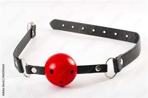 Fetish And Kinky Sex Play And Bdsm Sex Toys Concept With A Red Ball Gag
